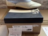 a box that has a pair of shoes on top of it