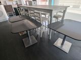 a table and chairs in a room with a large window