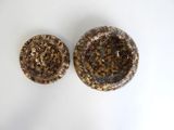 two brown and white bowls sitting on top of a white table