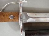 a knife with a wooden handle on a table