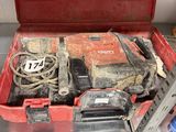 a red tool box with tools in it on a shelf