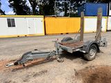 a trailer with a trailer attached to it in a parking lot