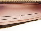 a close up of the inside of a pink purse