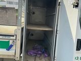 a white truck that has its door open and some purple gloves in it