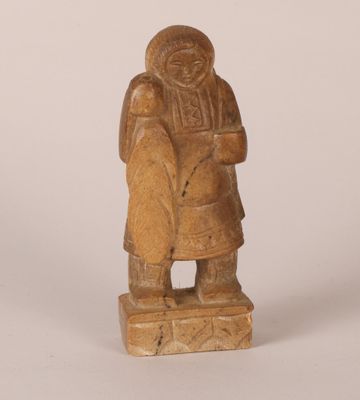 an image of a wooden statue of a woman holding a child