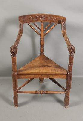 an old wooden chair sitting on top of a gray floor