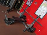 a gym room with a red wall and a gym equipment