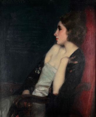 portrait of a woman in a black dress sitting in a red chair