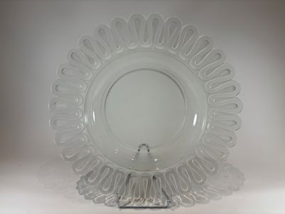 a clear glass plate with a decorative design on it