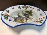 a blue and white bowl with a bird design on it