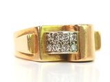 an image of a gold ring with a diamond set in the center