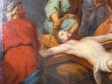 a painting of jesus laying on the cross with other people