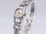 a close up of a wrist watch with diamonds on it