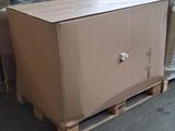 a large box sitting on a pallet in a warehouse