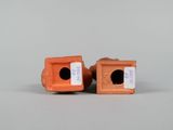 pair of orange ceramic figurines of a dog and a cat