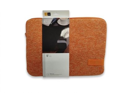 an orange laptop sleeve with a note pad and a keyboard