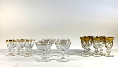 a lot of glasses that are sitting on a table