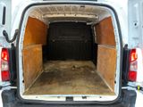 a white van with the back door open in the snow