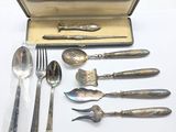 a box of silverware with a spoon, fork, spoon and spoon rest