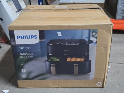 a box that is sitting on the ground with some food inside of it
