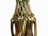 a gold vase that is sitting on a table