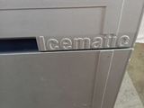 a silver refrigerator with a metal door and a sticker on it