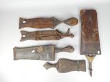 five different types of knives on a white surface