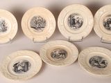 six plates with black and white images of people on them
