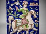 un carreau bleu et blanc représentant un homme à cheval