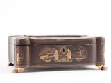 a small wooden box with a painting on it