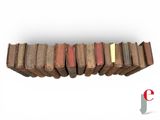 books stacked on top of each other on a white surface