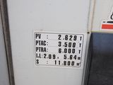 a close up of a gas station sign on the side of a building