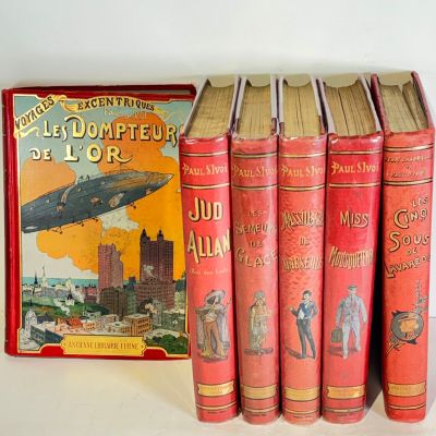 several books sitting on top of each other on a table