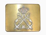 a gold belt buckle with a crown and two swords on it