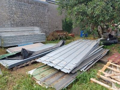 a pile of old metal sheets in the yard