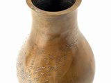 a brown vase that is sitting on a white surface