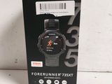 packaging of a smart watch with a black box on a white surface