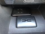 an image of a cell phone sitting on the center console of a car