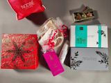 a box of chocolates and a bag of candy on a table