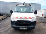 a white truck with a red and white stripe on the front