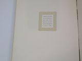 a white book with a picture of a cat on it