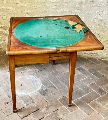 a wooden table with a green plate on it