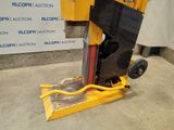 a machine that is sitting on the ground in the garage
