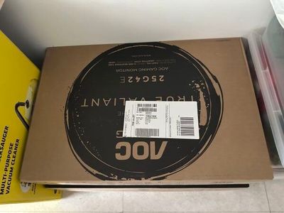 a box with a ticket on it sitting on the floor