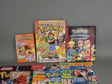 a lot of pokemon cards and games on the table