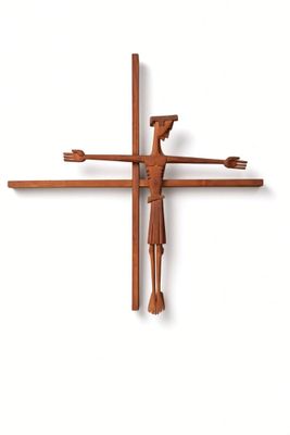 a cross made out of wood with a man on it