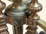 a close up of a metal candle holder on a table