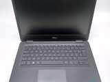 the dell laptop is open and ready to be used