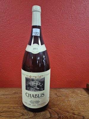 a bottle of wine that is sitting on a table