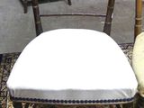 two chairs sitting next to each other in a room